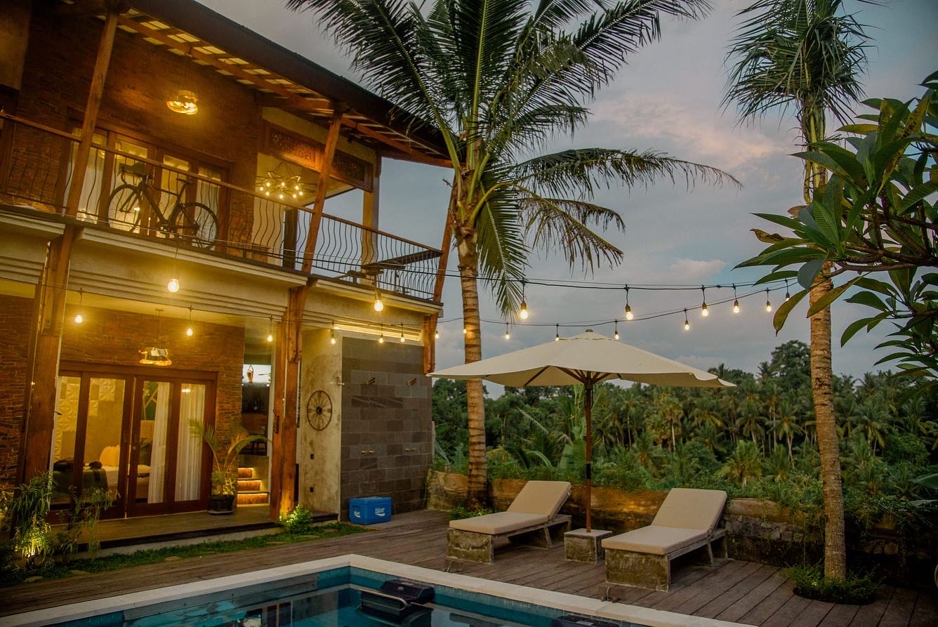 Bali retreat villa at dusk with sunbed